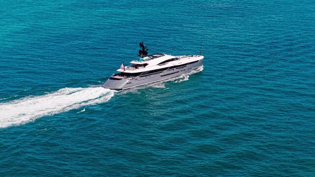 Miami, Florida, USA - February 05, 2025: Yachting boat tourism. Luxury life. Summer vacation. Yacht at sea. Motorboat yacht sailing at sea. Motorboat aerial view. Luxury boat motor yacht at sea