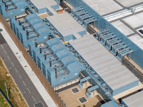 Aerial view of the Google Data Centre featuring industrial cooling units and rooftop infrastructure in Cheshunt, England, United Kingdom.