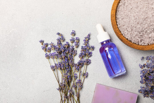 Lavender essential oil in glass and bottles with fresh lavender fowers. Natural aromatherapy. Organic skincare. Herbal cosmetic serum. Spa wellness treatment. Botanical Extract, beauty and self care