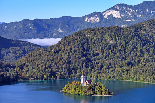 High Angle View of Bled Island and Assumption of Mary Church with Julian Alps in Lake Bled, Slovenia
