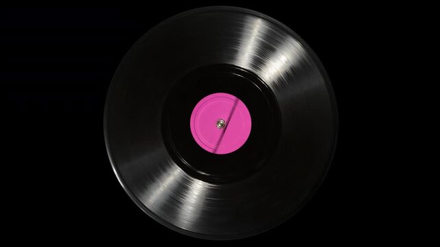 Vinyl record with blank label spins on turntable platter