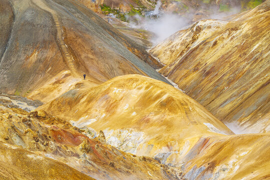 Aerial view of Kerlingarfjoll with colorful rhyolite mountains, geothermal steam vents, and hiking trails in Hrunamannahreppur, Iceland.