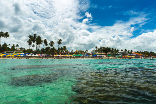 Tropical Beach Resort Viewed from Turquoise Ocean Water