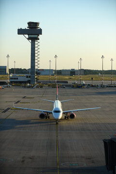 Beograd, Serbia - 08 January 2014: Aerial view of an airplane parked on the tarmac at Belgrade Nikola Tesla Airport with the control tower in the background.