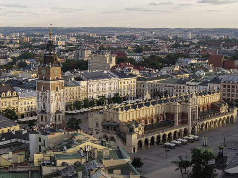 Krakow, Poland - 31 August 2026: Aerial view of MNK Sukiennice in the Main Market Square, surrounded by historic buildings, rooftops, and the Town Hall Tower.