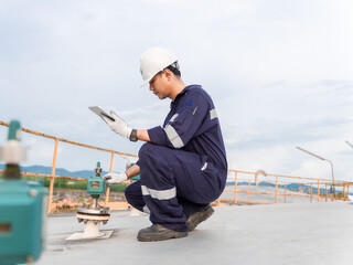 Petrochemical engineering checking controllers crude oil storage tank factory and industry. Maintenance engineer analysis work manufacturing production palm oil at refinery industrial plant. Fuel gas © Яe Life Яe World
