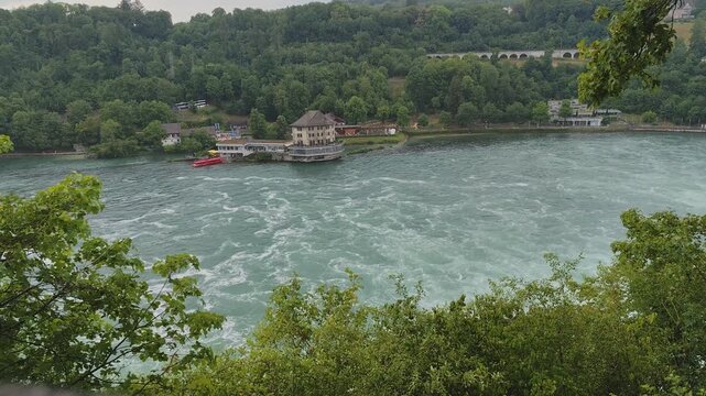 Rain under Rhine Falls Waterfall Water. Powerful fall Stream Rheinfall top view.