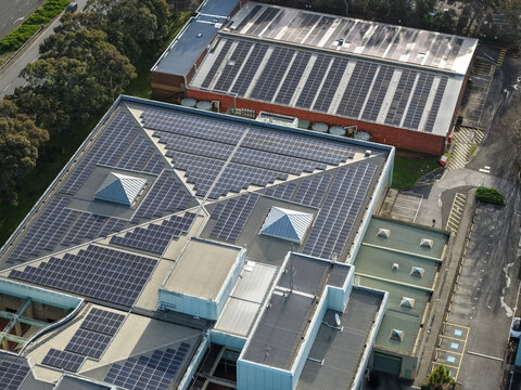 Wantirna South, Victoria, Australia - 03 September 2026: Aerial view of Knox Data Centre featuring extensive solar panel arrays on the rooftops, surrounded by parking areas and greenery.