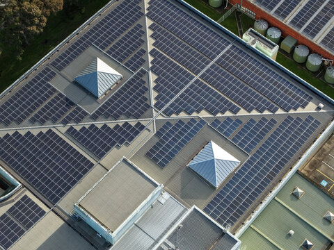 Wantirna South, Australia - 03 September 2026: Aerial view of Knox Data Centre featuring extensive solar panel arrays on the rooftop, skylights, and industrial building infrastructure.