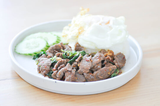 stir fried beef with basil or stewed beef or basil beef with rice and fried egg