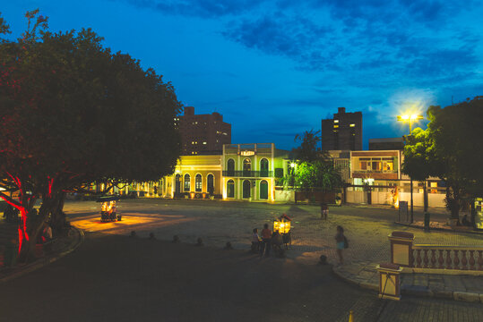 Historic Town Square at Night with Colonial Architecture