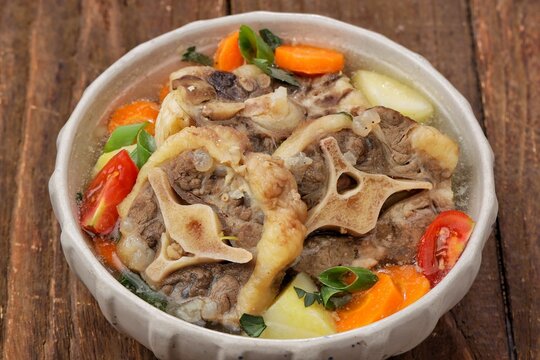 Sop buntut or oxtail soup, a traditional Indonesian oxtail soup made with tender beef oxtail simmered in a rich and flavorful broth with vegetables and aromatic spices..ribs soup
