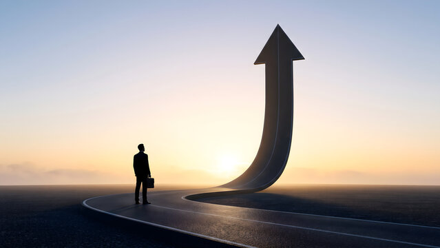 Businessman standing on winding road that curves upward into a giant rising arrow