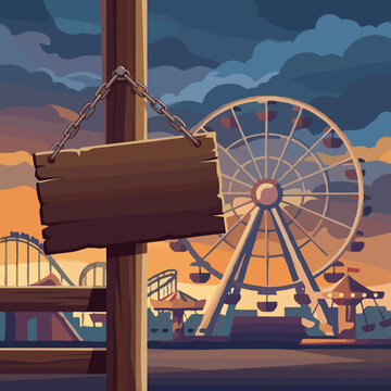 Blank wooden sign hanging by a chain on a wooden post in an abandoned or closed amusement park at sunset with a Ferris wheel, roller coaster, and carousel under a cloudy sky.
