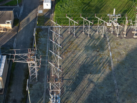 Croydon, Australia - 02 September 2026: Aerial view of Croydon Zone Substation showing electrical infrastructure, metal pylons, and long shadows cast across the gravel ground.