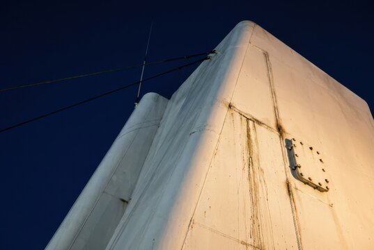 Ship Funnel Lit Against Deep Blue Night Sky on a Vessel
