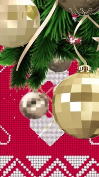 Animation of snow falling over christmas baubles decoration on red background