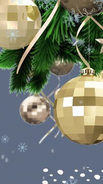 Animation of snow falling over hanging bauble decorations on a branch against grey background