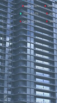 Animation of statistical and stock market data processing against tall buildings