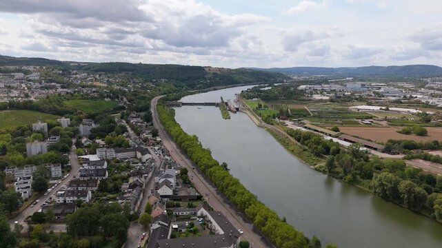 Mosel Power Plant in Trier, Germany, hydropower energy from nature, renewable energy at Moselle river, generating electricity from water power, aerial view over the valley