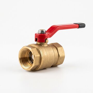 Professional brass plumbing ball valve with a red handle, clean studio photography, white background, no text
