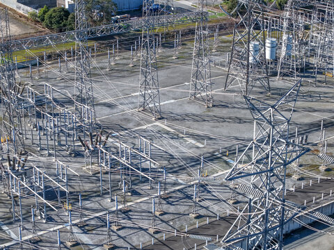 Ringwood, Victoria, Australia - 29 August 2026: Aerial view of Ringwood Terminal Station featuring steel transmission towers, power lines, and electrical infrastructure on gravel ground.