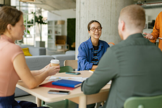 Business colleagues are planning a new strategy in a modern office
