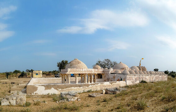View of the historic Gori Temple with its distinctive domes and stone architecture set in the arid landscape of Nagarparkar, Sindh, Pakistan.
