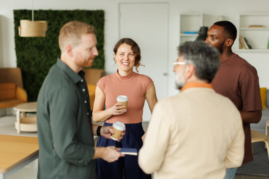 A business team enjoys a coffee break at the coworking space