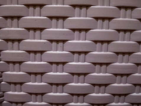 Close-up texture of plastic woven wicker basket pattern