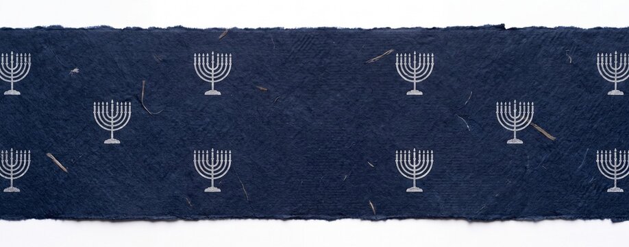 An elegant navy blue textile features a repeating pattern of minimalist silver menorahs, evoking a sense of tradition and spiritual celebration.