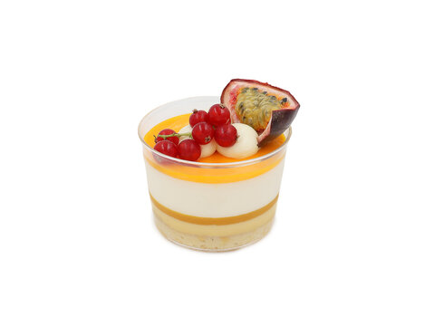 A delicious, festive dessert featuring panna cotta, redcurrants, and passion fruit, finished with passion fruit coulis and dollops of cream.