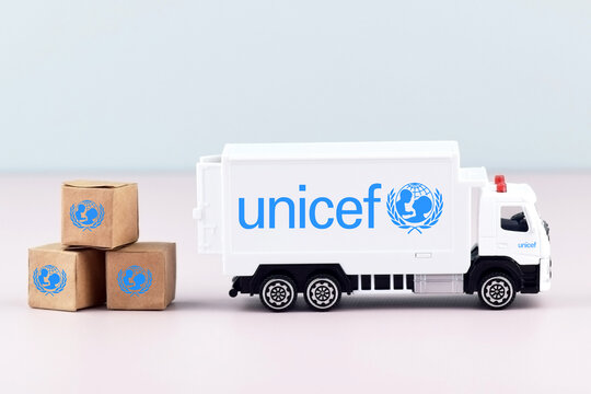 UNICEF logo on toy truck on the light background.