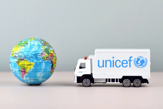 UNICEF logo on toy truck on the light background.