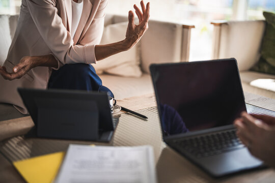 Businessman and businesswoman discussing a contract at the office