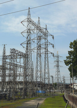 High-voltage transmission towers inside an electrical substation supplying electricity to the surrounding area.