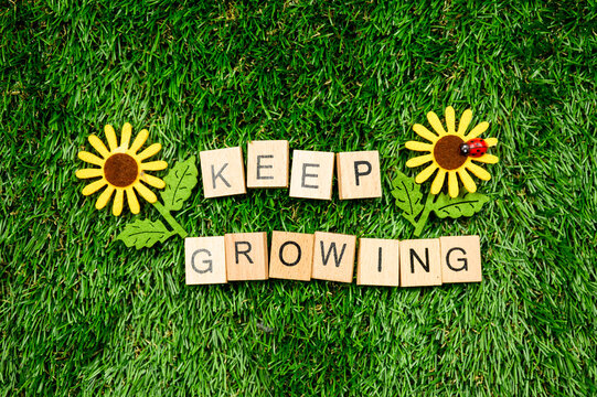 Keep Growing sign on grass