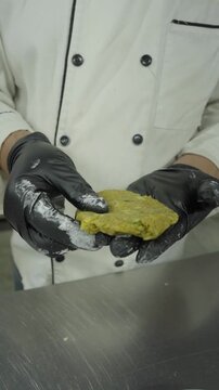 Close Up Flattening Seasoned Potato Dough Disc - Vertical Video