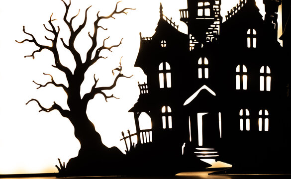 Haunted house or mansion silhouetted against a backlightingbackground.