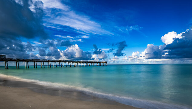 Early morning clouds over the Gulf of America formally the Gulf of Mexico at the Venice Pier in Venice Florida  in southwest Florida USA
