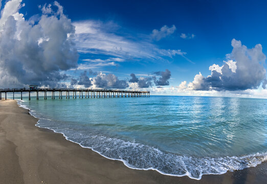 Early morning clouds over the Gulf of America formally the Gulf of Mexico at the Venice Pier in Venice Florida  in southwest Florida USA