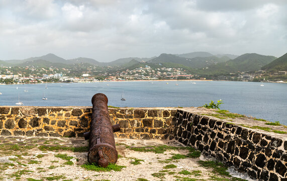 Historic cannon on the stone rampart of Fort Rodney overlooking Rodney Bay in Pigeon Island, Saint Lucia.