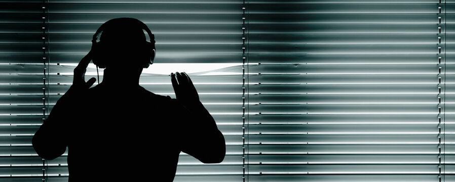 Germany, Bavaria, Man with head phone in recording studio