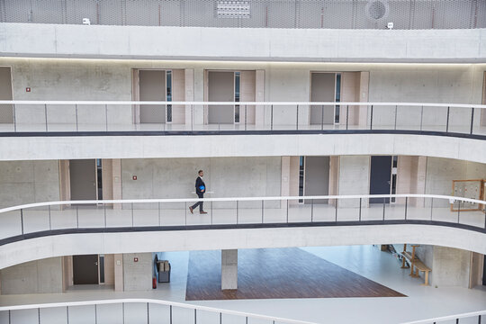 Businesssman walking in modern office building