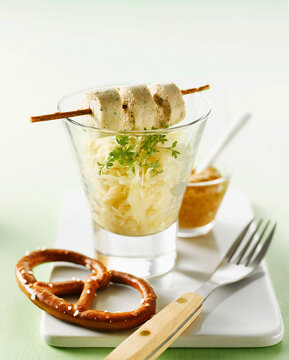 Bavarian tapas feature weisswurst and sauerkraut in a glass