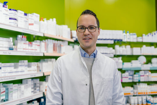 Portrait of smiling pharmacist in pharmacy