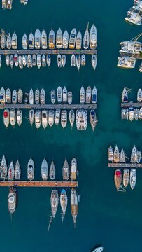 Aerial view of yachts and boats moored at a marina dock