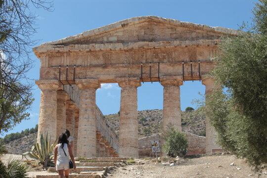 Visitor approaching the ancient Temple of Segesta in Sicily