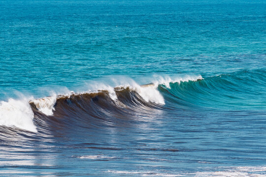 A large wave breaks on the Atlantic coast of Portugal