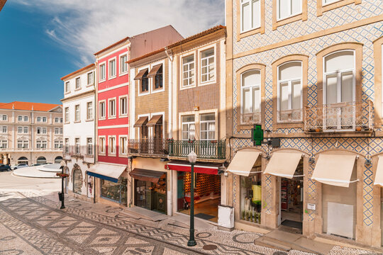 Historic buildings line a traditional street in Aveiro